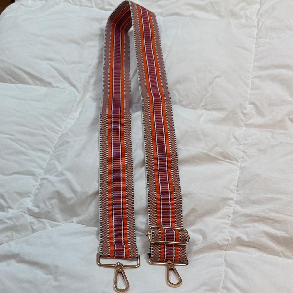 Crossbody bag strap.